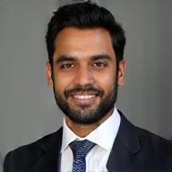 Professional headshot of Arjun Reddy.